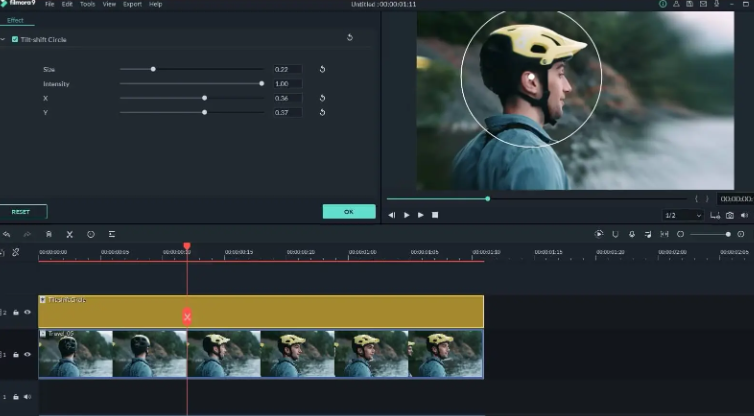 Filmora editor showing tilt-shift circle effect applied on video clip of cyclist